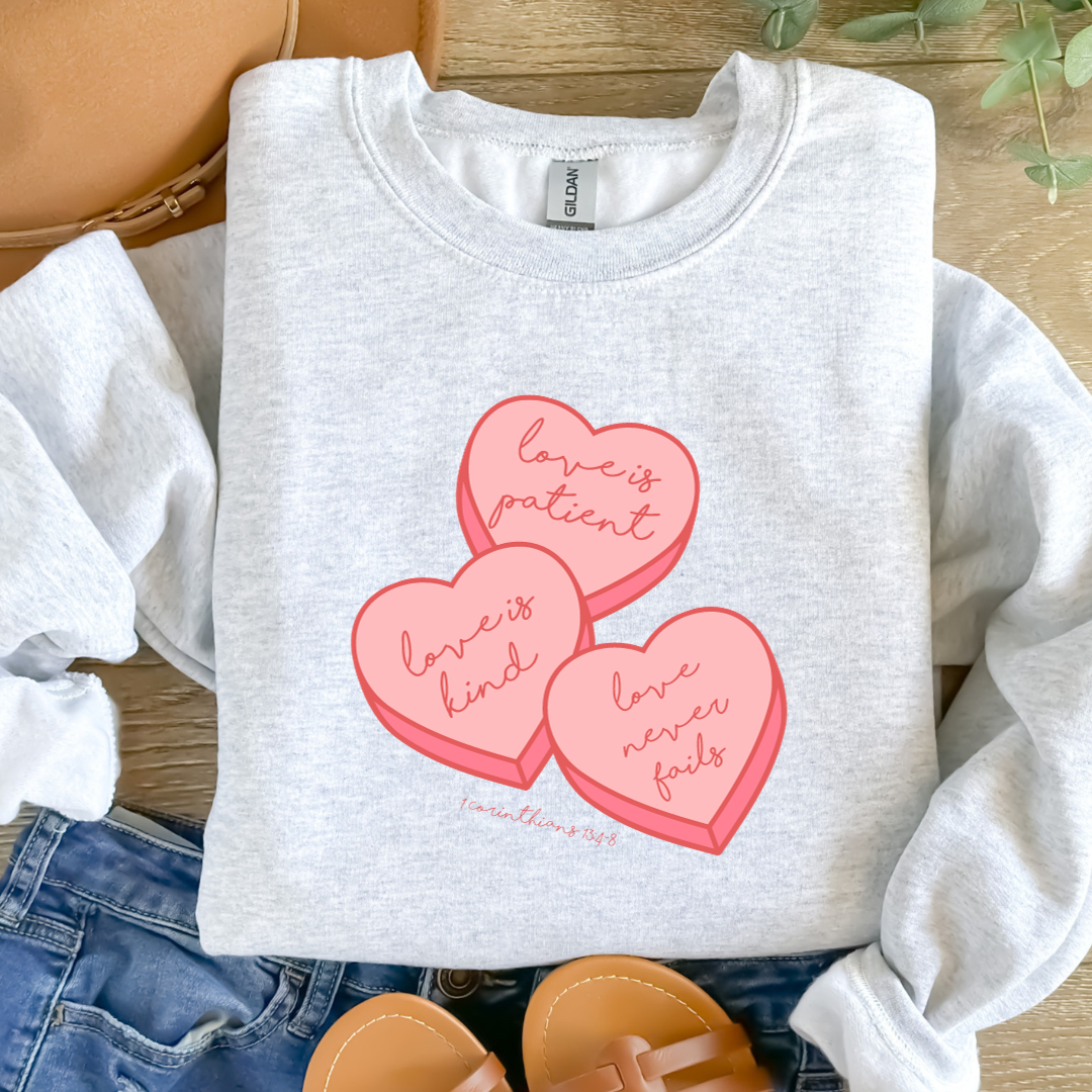 Love is Patient, Love is Kind, Love never fails. 1 Corinthians 13:4-8. - Valentine Inspired Christian Apparel - Sweatshirt