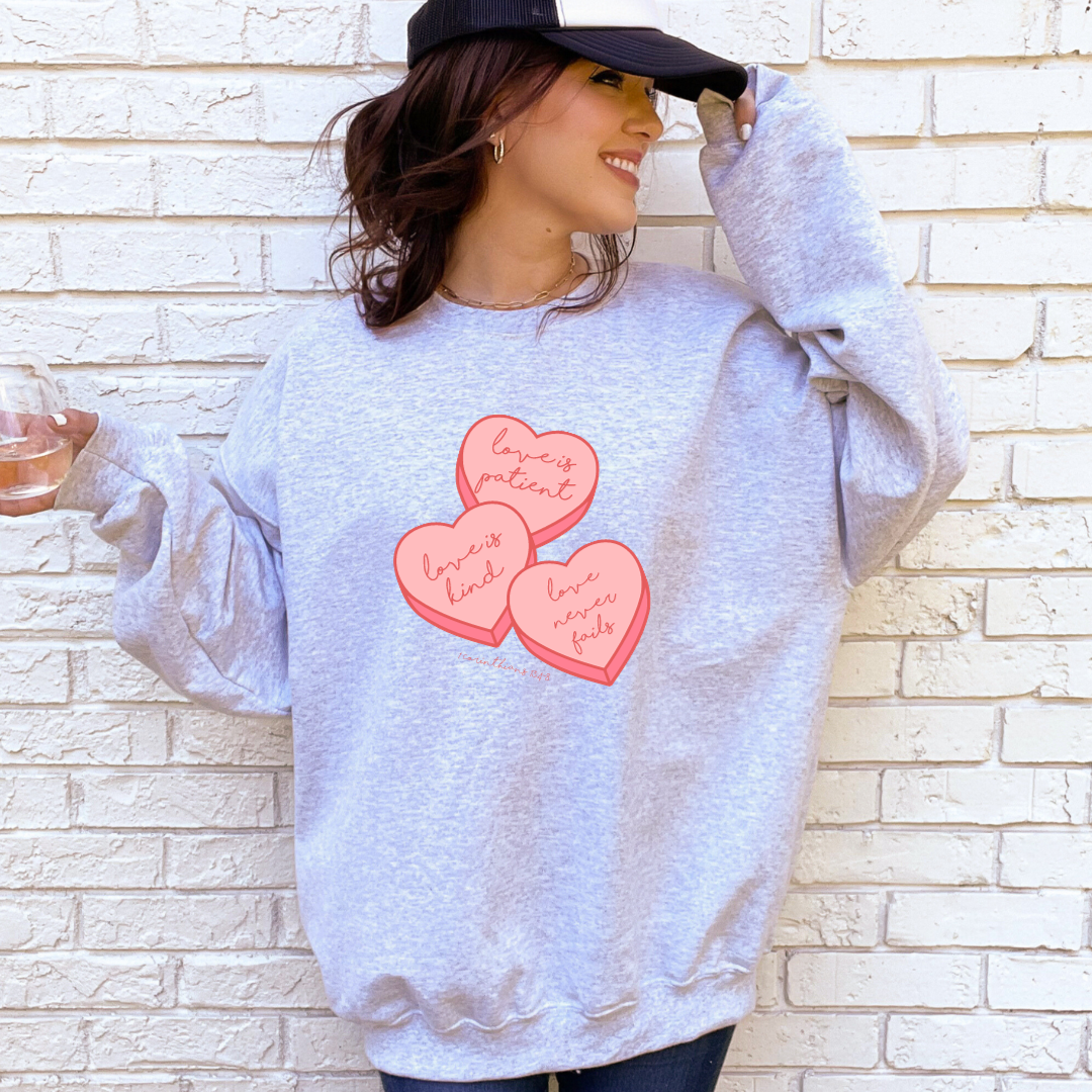 Love is Patient, Love is Kind, Love never fails. 1 Corinthians 13:4-8. - Valentine Inspired Christian Apparel - Sweatshirt